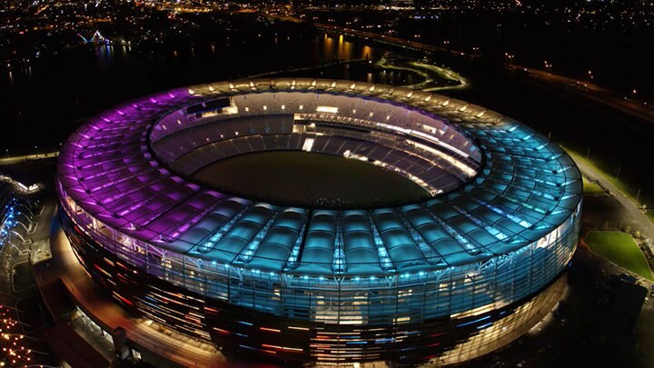 Aerial shot of a football stadium façade at night