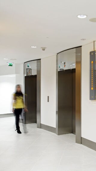 Corridor and elevators in the Tower 42 building, lit using Philips office lighting