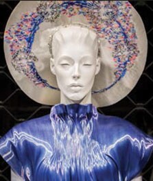 A mannequin wears a blue dress, which is color-enhanced by Philips LED flavors